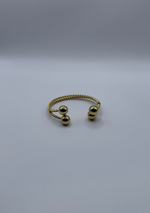 Pulsera dorada esferas elegantes